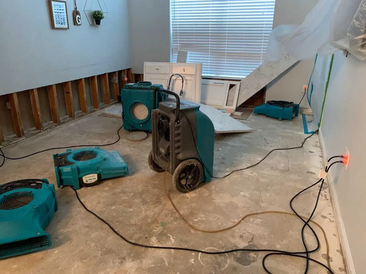 Dehumidifier in flood-cut room for Water Damage Restoration in Petoskey